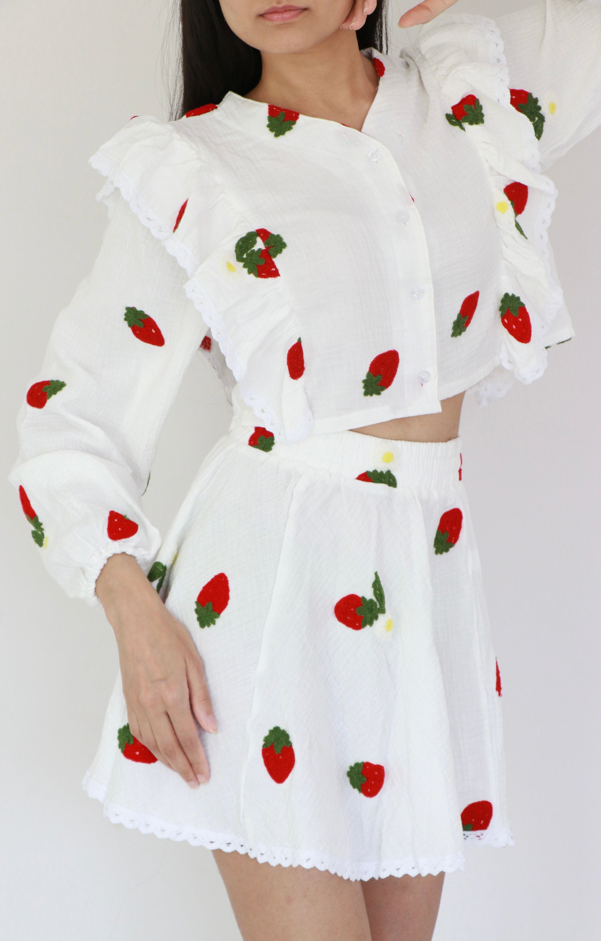 White cotton crop top with strawberry red embroidery, frill details, and matching mini skirt set for summer holidays